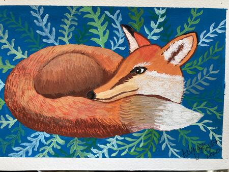 Fox Nestled in the Grass