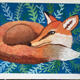 Fox Nestled in the Grass