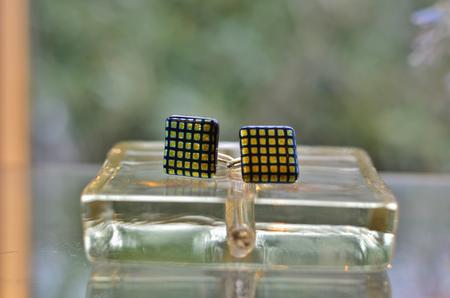 Dichroic check cuff-link