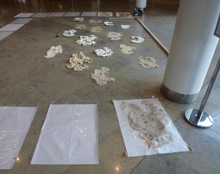Laying out the paper clouds prior to installation, Bridgewater Hall Manchester