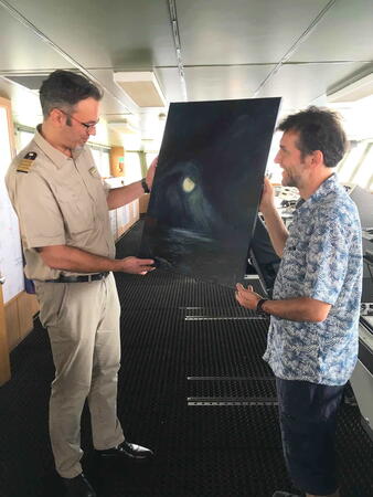Captain Wunderlich receives the painting on behalf of RV Polarstern
