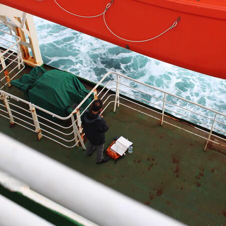 Me sketching the ocean from the port side lifeboat. Photo credit I. Shestakova.