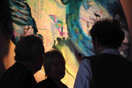 Lionel Playford chatting with leading scientists from the Alfred Wegener Institute, Peter Lemke and Karen Wiltshire infro t of artwork