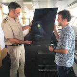 Captain Wunderlich receives the painting on behalf of RV Polarstern