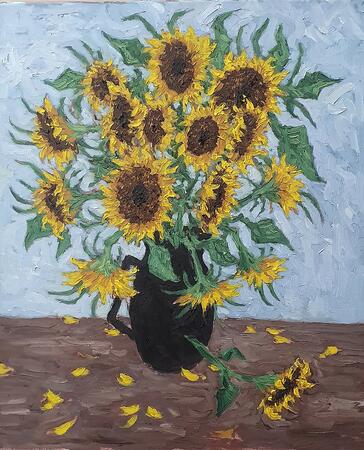 sunflowers in black jug