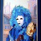 masked figure with blue feathers, venice carnival