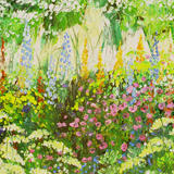 Garden border with light blue delphiniums