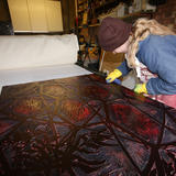 Rubbing excess ink from the printing block