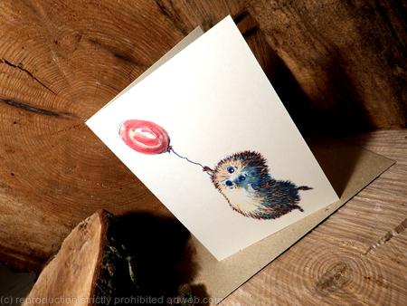Hedgehog ( Skillipig) with balloon ( no writing) N0. 32. This image can have HAPPY BIRTHDAY or any other short message in stick writing.