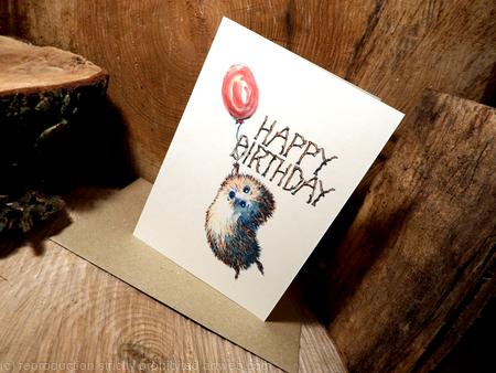 Hedgehog ( Skillipig) with balloon ( HAPPY BIRTHDAY) N0. 32. This image can have any other short message in stick writing instead .
