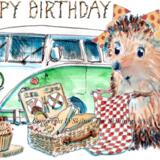 1297 Camper birthday picnic. Skillipig 6 by 4 inch greeting card with brown envelope.