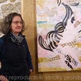 Artist with her painting Quirk at Ruskin Mill Gallery