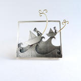 After paper prayers on stormy seas