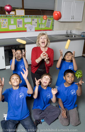 Berenice Bonallack photographed with the kids she is teaching to cook for Yours magazine