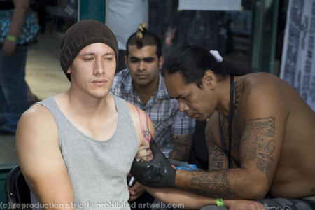 Man recieving a Samoan tattoo. London Tattoo Convention