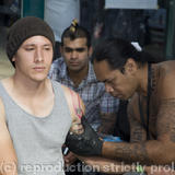 Man recieving a Samoan tattoo. London Tattoo Convention