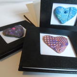 Concertina books - black bookcloth cover with cut outs and handmade embellishments