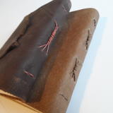 Leather covers waxed cord binding