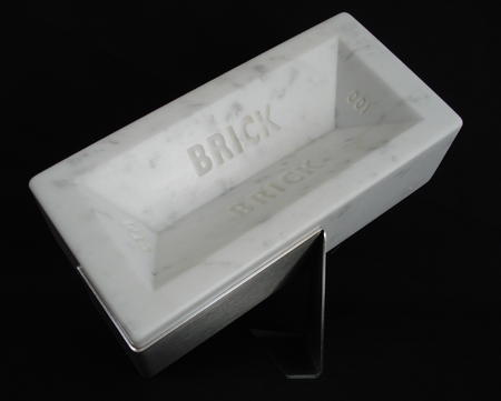 'It's not a property ladder, it's a property wall'. Housebrick carved from Carrara marble, life size, numbered, limited edition of 999, £500
