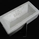 'It's not a property ladder, it's a property wall'. Housebrick carved from Carrara marble, life size, numbered, limited edition of 999, £500