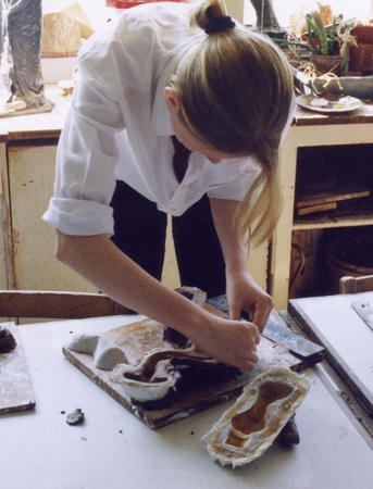 Student making moulds at Kings College Guildford