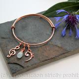 Adjustable bracelet with musical and birth stone charms