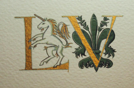 Gold letters with a unicorn and Florentine giglio