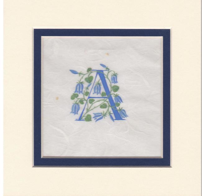 Initial A in dark blue with bluebells