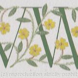 Double initials in green with Primroses.