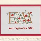 Two gold initials with strawberries