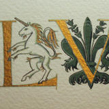 Gold letters with a unicorn and Florentine giglio