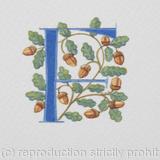 Letter painted in blue with oak leaves and acorns