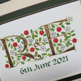 23c gold letters with red and white heraldic roses.