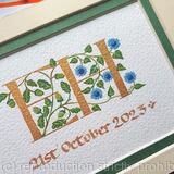 Double initials handpainted with acorns, oak leaves and blue sunflowers.