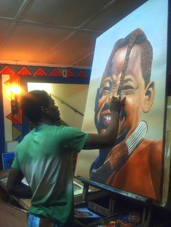 Genuine smile- Himba girl painting in progress