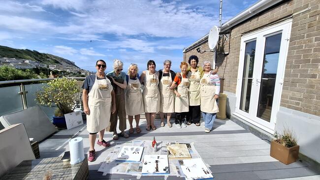 Working on the decking overlooking Chesil Cove