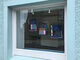 Window with wall hangings by Amy Blackwell