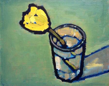 Tulip in a small glass vase