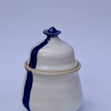 White glazed lidded pot with Blue Stripe