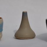 2 small bowls and a bud vase