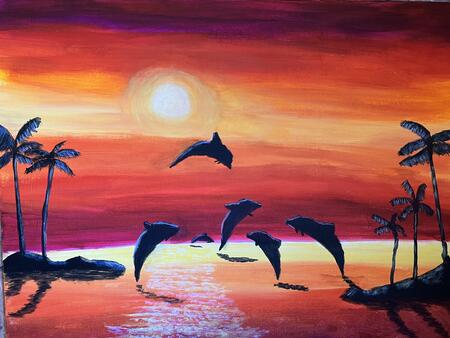 Dolphins jumping in the sunset 