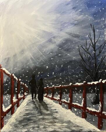Couple walking in the snow at night