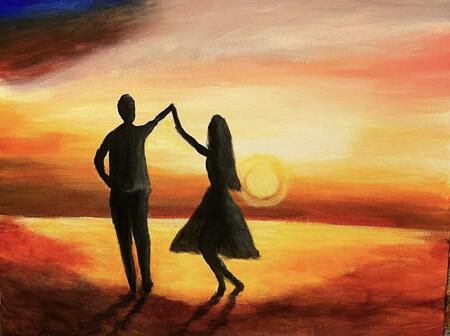 Couple dancing on the beach at sunset 