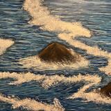 Rock inbetween waves