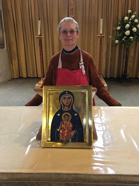Iconostasis student Joan with completed Mother of God of Victories Icon