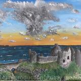Dunluce Castle at sunset with storm brewing