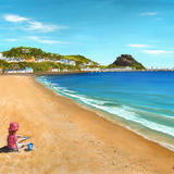 Playing in the sand at Grouville Bay, Jersey