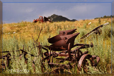 Vintage farm implement and flatbed on the hill