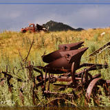 Vintage farm implement and flatbed on the hill