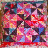 Patchwork memory cushion with mitred border